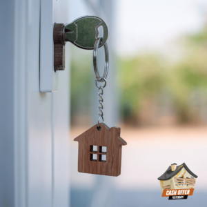 Key inserted in a doorknob with a mini house keychain, symbolizing fast and hassle-free house buying -We Buy Houses Bridgeport Texas