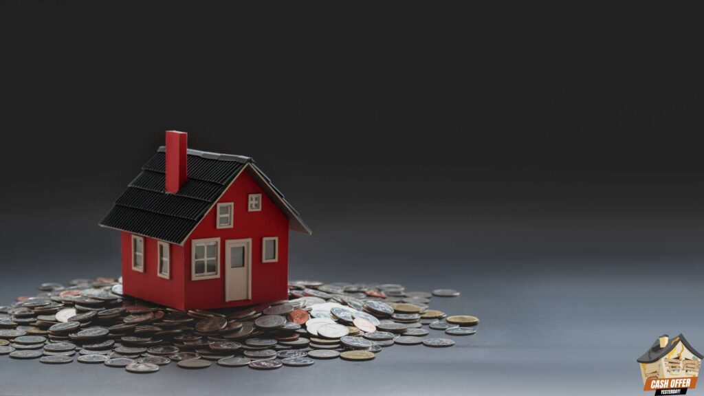 Miniature house placed on top of a stack of coins - We Buy Houses in Decatur TX