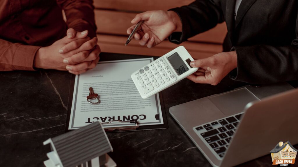 Two people discussing a contract, with the buyer holding a calculator, a laptop, a miniature house, and a key on the table - We Buy Houses in Colleyville TX