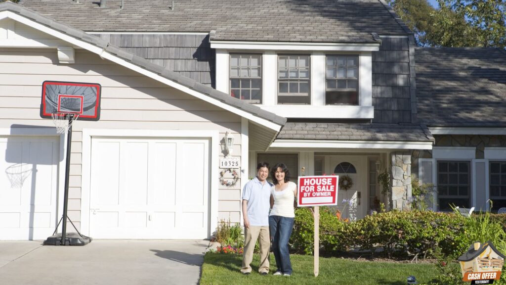 A couple standing beside a 'house for sale by owner' sign with a house in the background - We Buy Houses in Colleyville TX